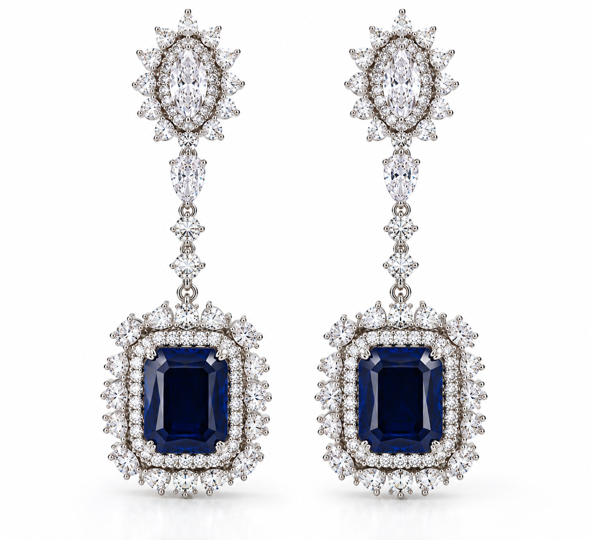 Aurelia lab grown blue sapphire and diamond drop earrings in 18K white gold, featuring emerald-cut sapphires and diamond halos.