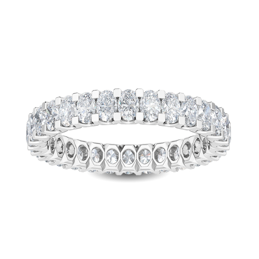 Oval brilliant lab-grown diamond wedding band paired with an engagement ring

